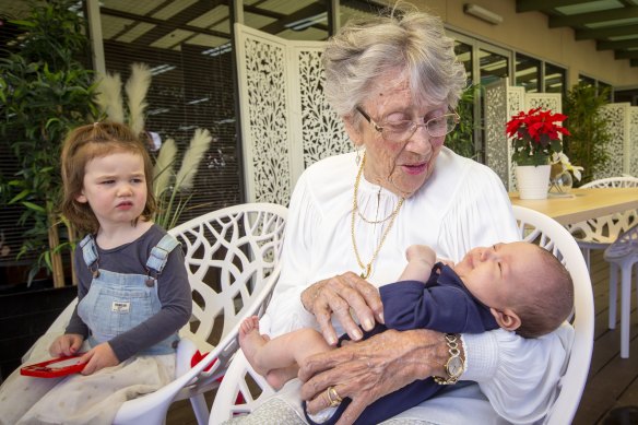 Sally O'Shaughnessy holds great-grandson Rafael for the first time, as great-granddaughter Charlotte looks on. 