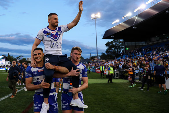 Josh Reynolds is chaired around Belmore after his farewell game.