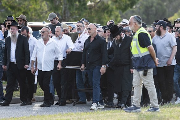 Mourners gathered at the funeral of Reuven Morrison in Melbourne on Thursday evening.
