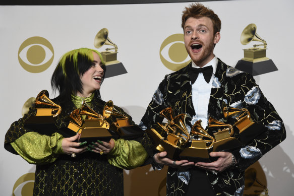 Billie Eilish, left, and Finneas O'Connell with all their Grammys.