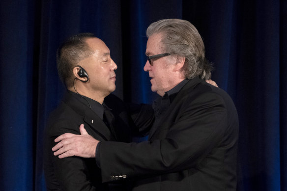 Former White House chief strategist Steve Bannon, right, greets fugitive Chinese billionaire Guo Wengui in New York.