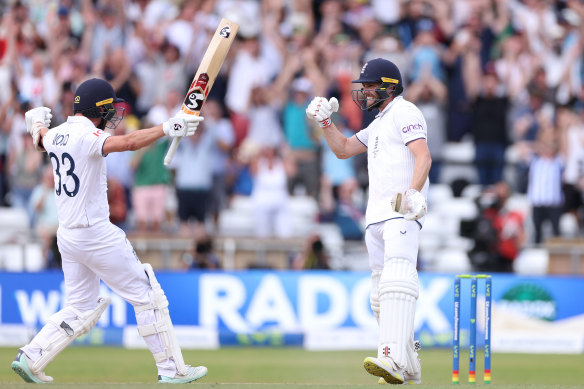England’s Chris Woakes and Mark Wood celebrate their win at Headingley.