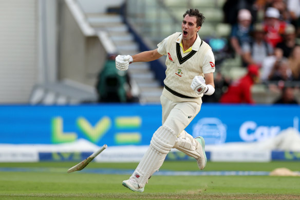 Pat Cummins celebrates the winning runs.