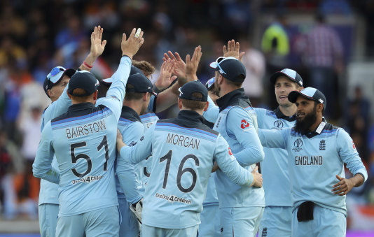 England's cricketers celebrate the dismissal of Indian batsman Hardik Pandya.