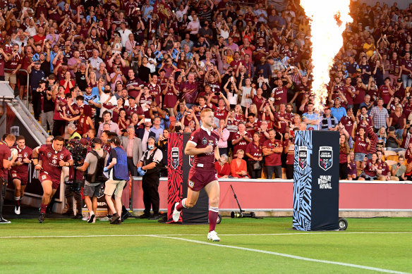 Daly Cherry-Evans leads the Maroons into Suncorp Stadium during State of Origin game three in 2020.