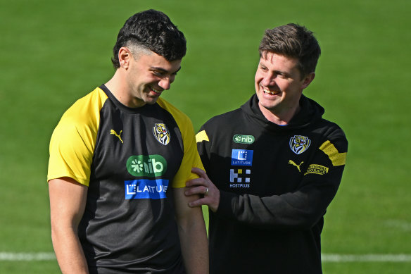 In good hands: Replacement Richmond coach Andrew McQualter chats with Tim Taranto on Tuesday.