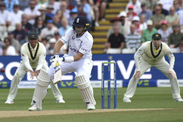 Joe Root tries to scoop Pat Cummins at Edgbaston.