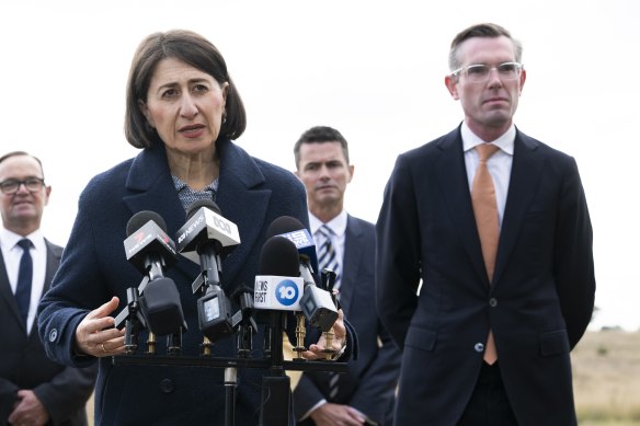 Changing of the guard: then-Premier Gladys Berejiklian with Dominic Perrottet at Badgerys Creek in June. 