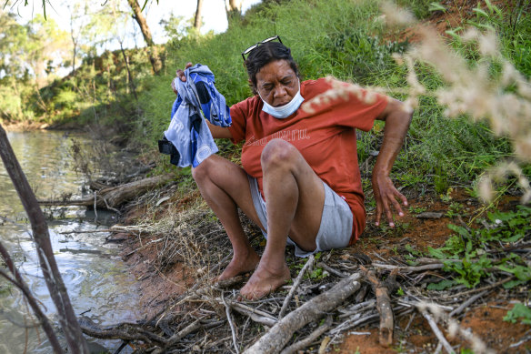 Catherine Bugmy doing her washing in the Darling River outside Wilcannia.