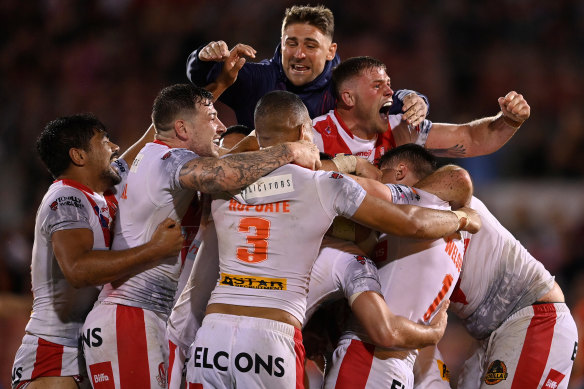 Jubilant St Helens players celebrate their dramatic win on Saturday night.