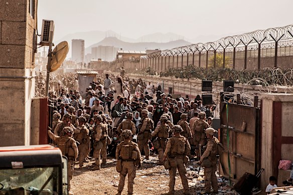 US Marines providing assistance during an evacuation at Hamid Karzai International Airport, Kabul, Afghanistan in 2021.