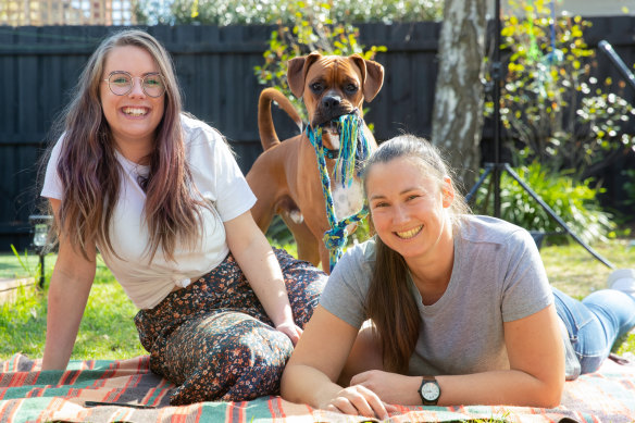 Loz Robinson and Emily Hallam from Melbourne's Glen Iris adopted 14-month-old boxer Cooper in July. 