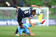 Josh Brillante of the Victory and Connor O’Toole of Sydney FC tussle for the ball.