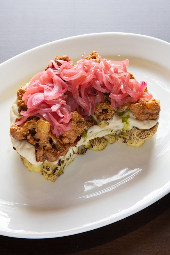 Cauliflower steak comes with cauliflower puree, pickled onions and chimichurri.