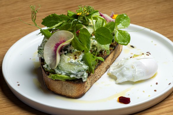Charred avocado toast with harissa hummus, feta and wasabi granola.