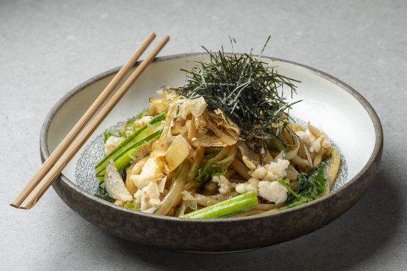 Spanner crab noodles are boosted by shredded nori and bonito flakes.