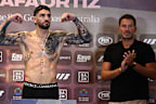 Michael Zerafa poses as Eddie Hearn looks on.