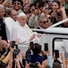 Pope Francis tours St. Peter’s Square in his popemobile.