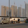 No doors, no water: The people living in the shadows of China’s property bust