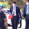 A detective leave Lewis Contintental Kitchen with a jerry can on Sunday afternoon. 