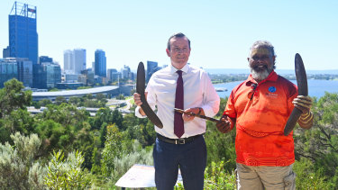 WA Premier Mark McGowan and Noongar cultural tours operator Walter McGuire hold a message stick together at Kings Park for the announcement of a $217 million tourism package election pledge.