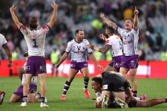 Cameron Smith and the Storm celebrate their grand final win on the whistle. 