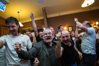 England fans celebrating the first goal in the Euro final at the Charles Dickens Tavern in Melbourne.