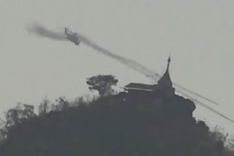 A Myanmar military helicopter fires rockets west of Loikaw in Kayah state on February 21, an image provided by Free Burma Rangers. 