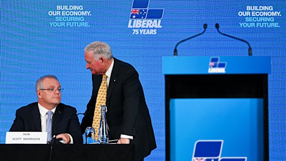Nick Greiner speaks to Prime Minister Scott Morrison at the Hyatt Hotel in Canberra on Friday.