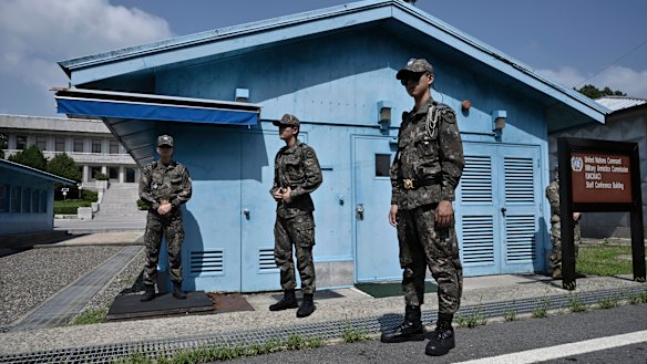 South Korean soldiers stand guard at the truce village of Panmunjom in the Demilitarised Zone (DMZ) dividing the two Koreas on Saturday.