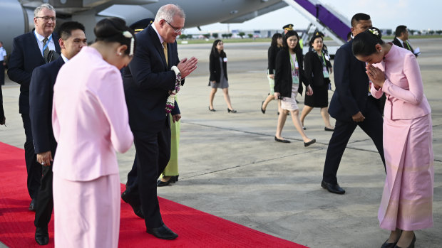 Australian Prime Minister Scott Morrison is greeted upon his arrival in Bangkok. 