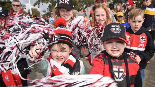 Young St Kilda supporters march across Matagarup Bridge. 