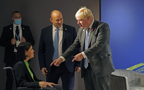 British Prime Minister Boris Johnson is introduced to Israel’s Energy Minister Karine Elharrar during a meeting with Israel’s Prime Minister Naftali Bennett on the side-lines on day three of COP26.