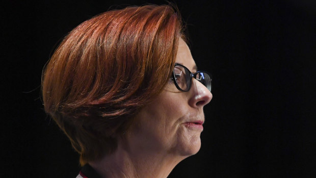 Julia Gillard has called for Australia's political parties to strike a UK-style bipartisan agreement over its aid budget.