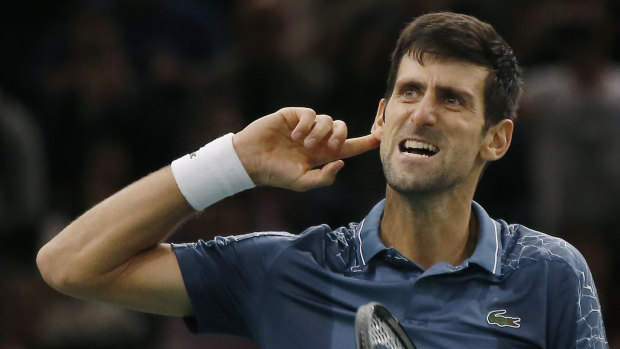 Louder: Novak Djokovic gestures to the crowd after his thrilling victory over Roger Federer.
