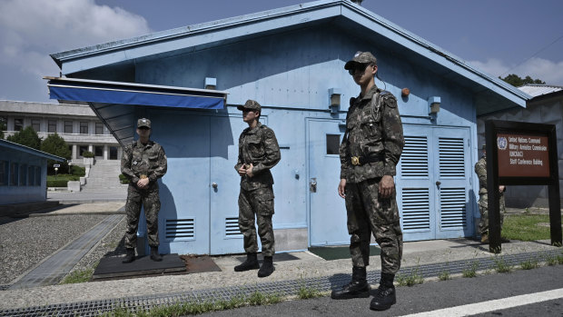 South Korean soldiers stand guard at the truce village of Panmunjom in the Demilitarised Zone (DMZ) dividing the two Koreas on Saturday.