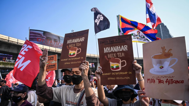 Protesters demonstrating in solidarity with Myanmar’s anti-coup movement carry “Milk Tea Alliance” placards in Bangkok. 