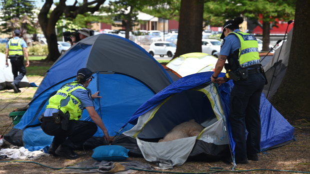 Police take down the tents at the homeless camp in Fremantle’s Pioneer Park. 