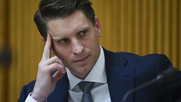 Committee chair Andrew Hastie reacts during a hearing of parliamentary intelligence and security committee at Parliament House in Canberra.