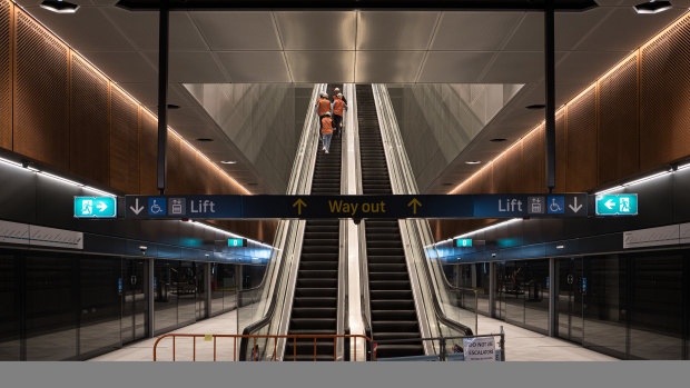 Escalators link platforms to Crows Nest station’s main underground concourse.