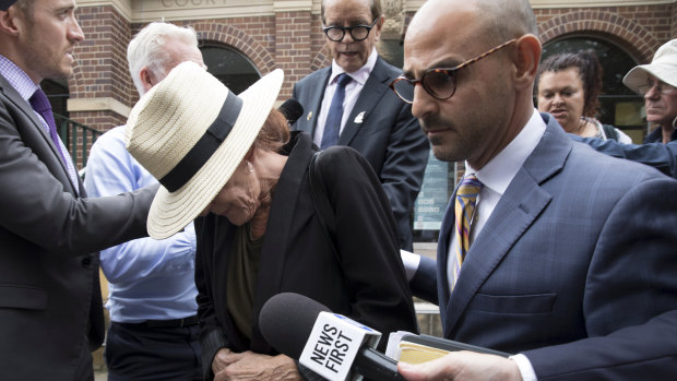Jane Monmouth, the mother of accused Mathew Flame, with criminal lawyer Omar Juweinat