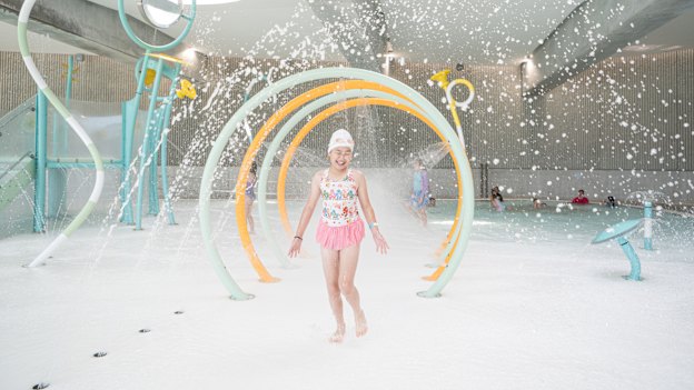 Sienna Yip, 9, trials the children’s splash play area at the aquatic centre.