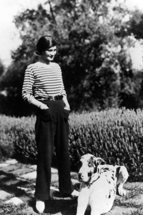 Coco Chanel at  La Pausa in Roquebrune, on the French Riviera, with her dog, Gigot.