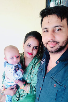 Kuldeep Rawal, with his wife Renu Dhaka and son Kushaal Rawal, before the pandemic. He hasn’t seen his family for 18 months and is a stranger to his son.
