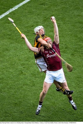 Joe Canning, front, gets some attention while going for a high ball.