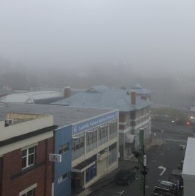 Fog covers inner-Brisbane just before 6am on Sunday.
