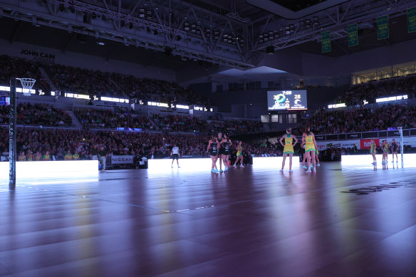 Players look on, as the lights turn off temporarily during the third quarter in game one of the 2023 Constellation Cup series.
