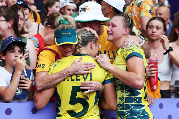 Teagan and Maddison Levi are comforted after the women’s sevens side’s loss in the bronze-medal match.