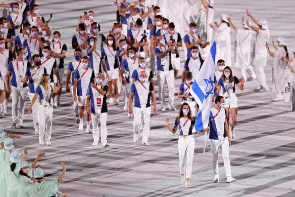 Hanna Minenko and Yakov Toumarkin of Team Israel lead their team during the Opening Ceremony of the Tokyo 2020 Olympic Games at Olympic Stadium in 2021.