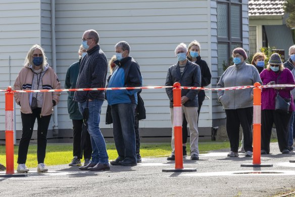 Phillip Island residents wait to be tested for coronavirus at the St Philips Anglican Church. 